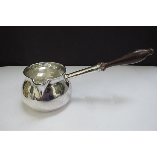 6442 - A George II silver brandy warmer of squat form, turned wooden handle, engraved with a crest for the ... 