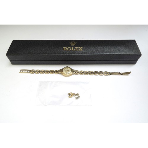 6401 - A 9ct gold Rolex lady's wristwatch with spare links, boxed, 15.5g