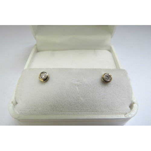 6402 - A pair of 14ct gold diamond stud earrings, 1g