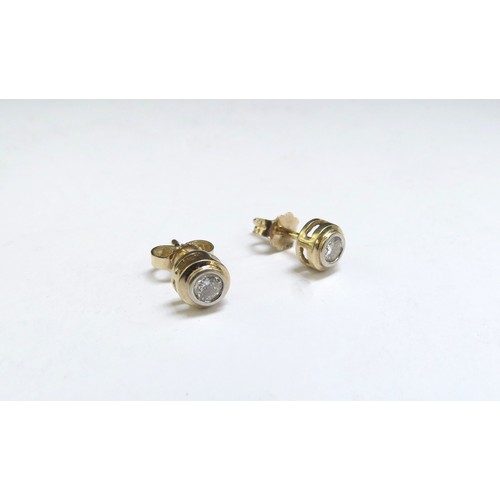 6402 - A pair of 14ct gold diamond stud earrings, 1g