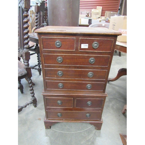 2206 - A reproduction mahogany diminutive chest on chest