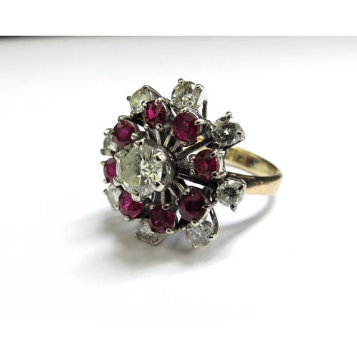 6394 - A ruby and diamond cocktail ring, the centre diamond 0.75ct approx surrounded by eight rubies and ei... 