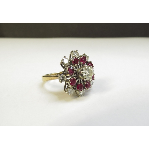 6394 - A ruby and diamond cocktail ring, the centre diamond 0.75ct approx surrounded by eight rubies and ei... 