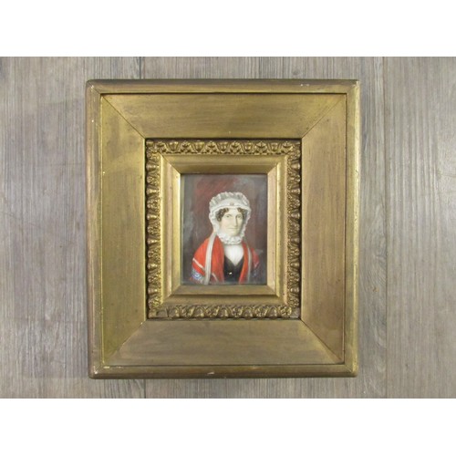 6085 - A 19th Century watercolour on ivory panel of a woman in white bonnet and red cloak. Unsigned. Set in... 