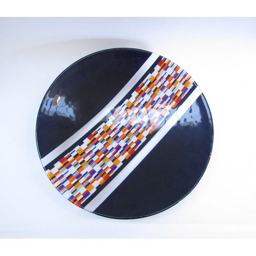 9183 - A large studio glass charger, possibly by a Welsh artist, black with central band in block colours. ... 