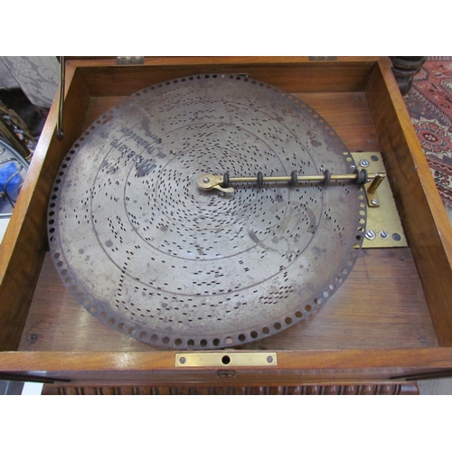 6083 - A 19th Century walnut cased table Polyphon, marquetry inlaid top, with approximately 25 15.5'' discs