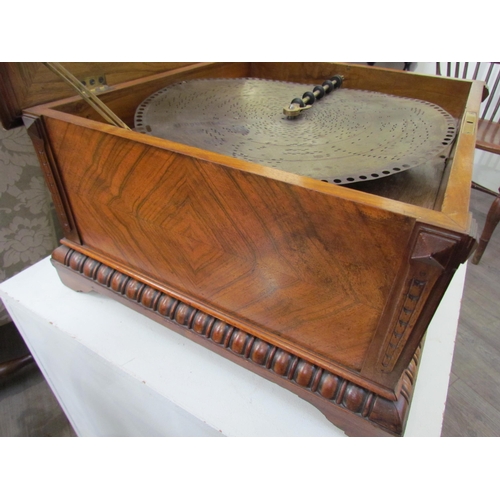 6083 - A 19th Century walnut cased table Polyphon, marquetry inlaid top, with approximately 25 15.5'' discs