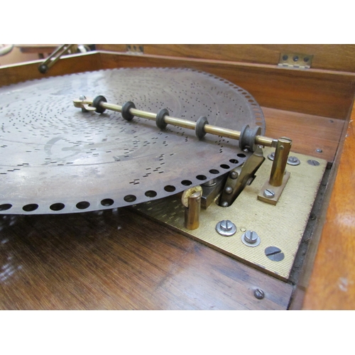 6083 - A 19th Century walnut cased table Polyphon, marquetry inlaid top, with approximately 25 15.5'' discs