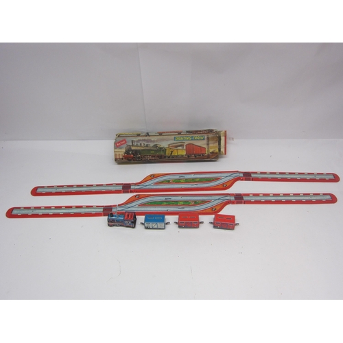 8526 - A boxed Technofix (Germany) 289 Shunting Train set comprising tinplate clockwork locomotive, three w... 