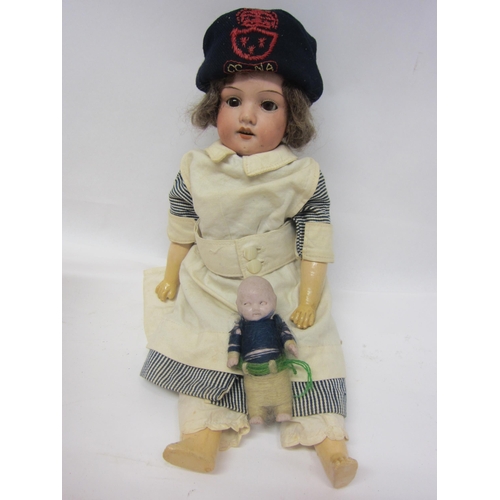 8313 - An Armand Marseille WWI nurse character doll, bisque head with sleepy brown glass eyes, open mouth s... 