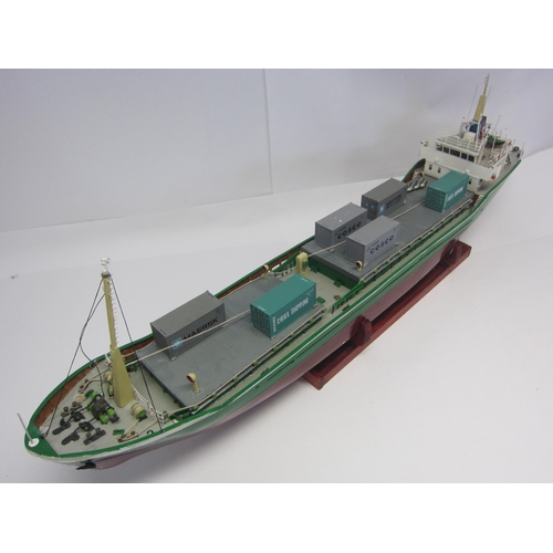 8420 - A wood and fibre glass kit built model ship 'Timrix', finished in green and red with brass propellor... 