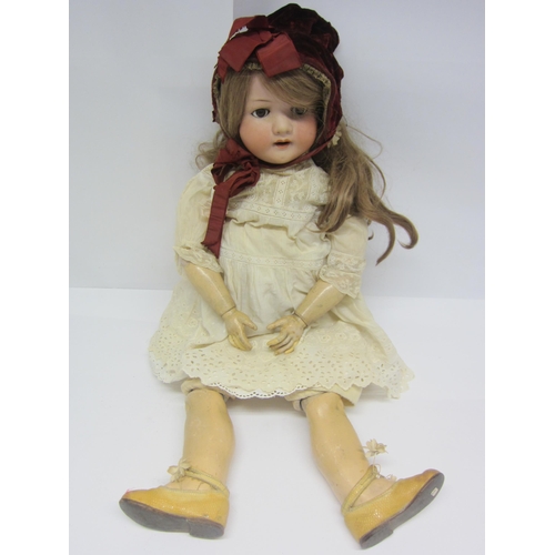 8331 - A Heubach Koppelsdorf bisque head girl doll with blonde wig, brown glass sleepy eyes, painted brows,... 