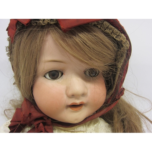 8331 - A Heubach Koppelsdorf bisque head girl doll with blonde wig, brown glass sleepy eyes, painted brows,... 