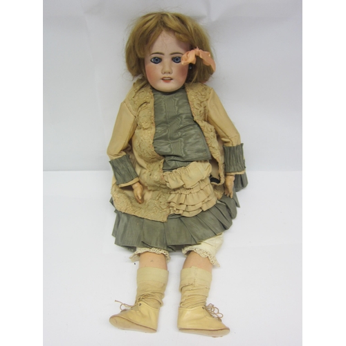 8314 - An early 20th Century French bisque head girl doll with blonde wig, striated blue glass fixed eyes, ... 