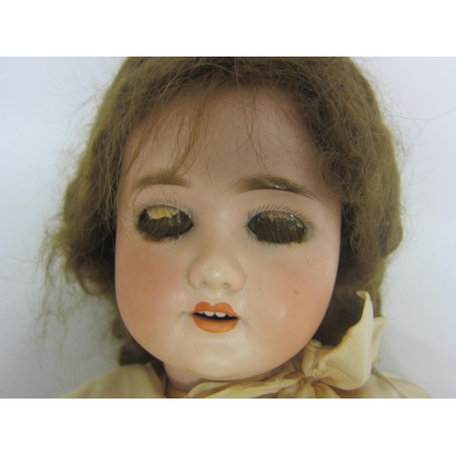 8315 - An early 20th Century Schoneau & Hoffmeister bisque head girl doll with brown wig, striated blue gla... 