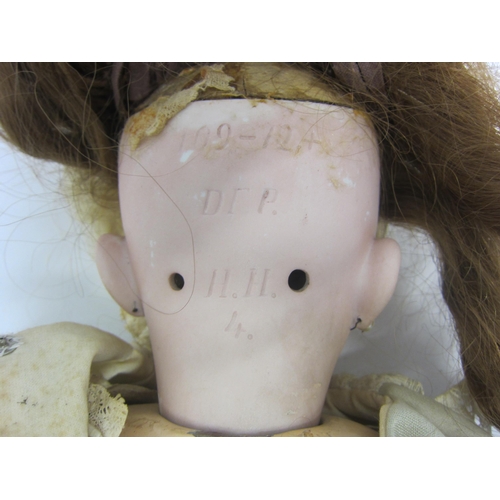 8328 - An early 20th Century German bisque head doll with mousey brown wig, striated blue glass sleepy eyes... 