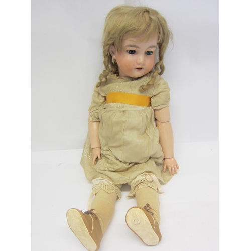 8324 - An early 20th Century Armand Marseille bisque head girl doll with blonde ringlet wig, blue glass sle... 