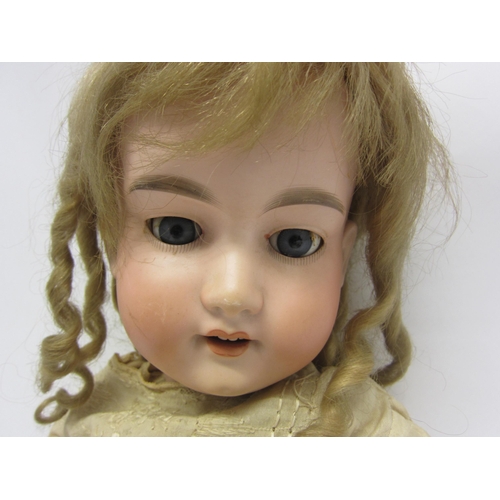 8324 - An early 20th Century Armand Marseille bisque head girl doll with blonde ringlet wig, blue glass sle... 