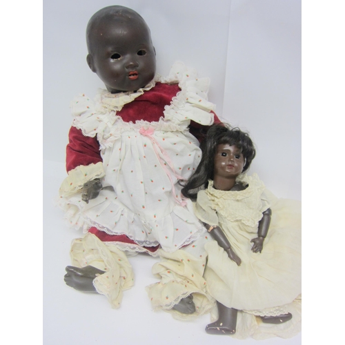 8319 - Two black bisque head dolls to include Armand Marseille 351 baby, 60cm tall, and smaller girl doll, ... 