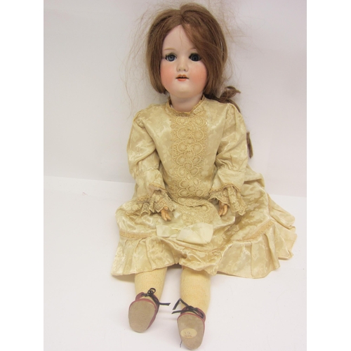 8322 - An early 20th Century Armand Marseille bisque head girl doll with strawberry blonde wig, striated bl... 