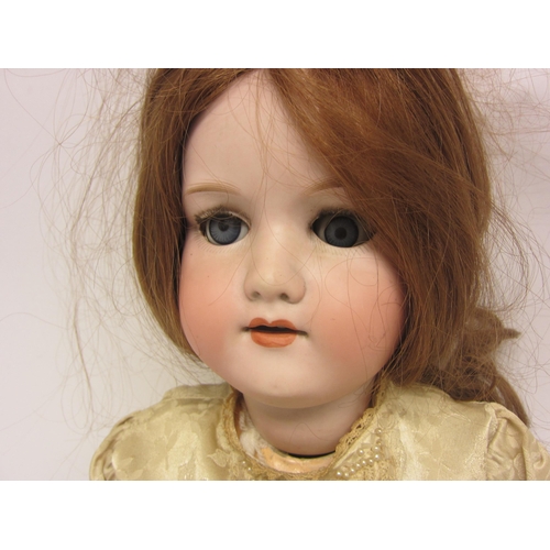 8322 - An early 20th Century Armand Marseille bisque head girl doll with strawberry blonde wig, striated bl... 