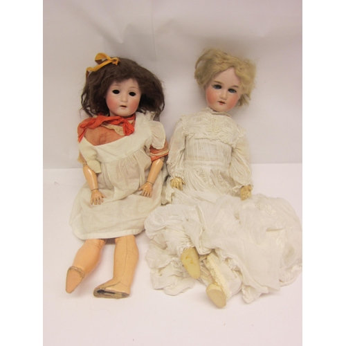 8311 - Two early 20th Century German bisque head dolls on articulated wood and composition bodies, to inclu... 