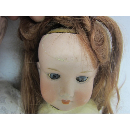 8321 - Two early 20th Century bisque head dolls on articulated composition bodies, to include Armand Marsei... 