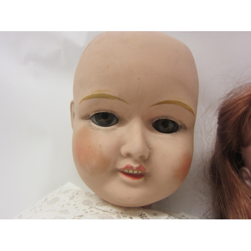 8321 - Two early 20th Century bisque head dolls on articulated composition bodies, to include Armand Marsei... 