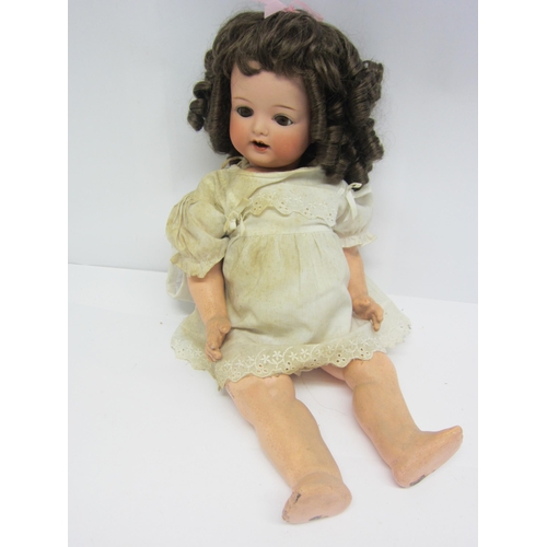 8323 - An Armand Marseille for Koppelsdorf bisque head girl doll with brown ringlet wig, brown glass sleepy... 