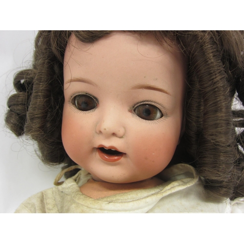 8323 - An Armand Marseille for Koppelsdorf bisque head girl doll with brown ringlet wig, brown glass sleepy... 