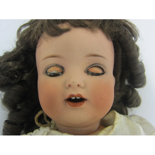 8323 - An Armand Marseille for Koppelsdorf bisque head girl doll with brown ringlet wig, brown glass sleepy... 