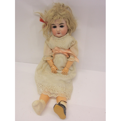 8325 - An early 20th Century Armand Marseille bisque head girl doll with blonde wig, striated blue glass sl... 