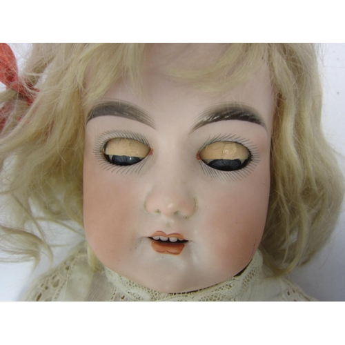 8325 - An early 20th Century Armand Marseille bisque head girl doll with blonde wig, striated blue glass sl... 