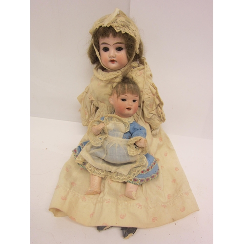 8316 - Two erly 20th Century bisque head dolls to include Trebor 22 socket head doll on articulated composi... 