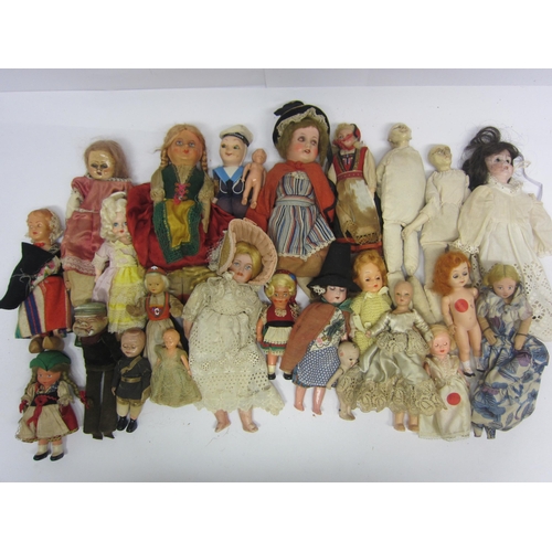 8294 - A collection of assorted character and costume dolls including bisque, plastic, celluloid and felt e... 