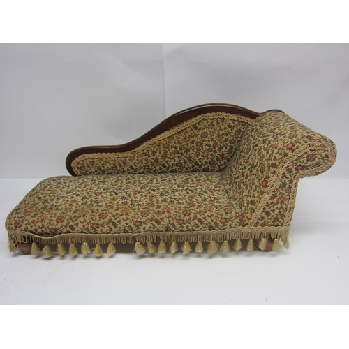 8296 - A Victorian style dolls chaise longue with floral tapestry upholstery, 65cm long x 28cm tall