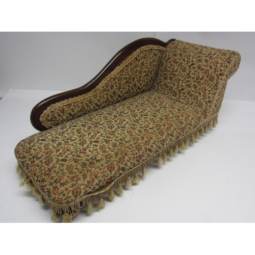 8296 - A Victorian style dolls chaise longue with floral tapestry upholstery, 65cm long x 28cm tall