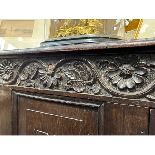 6047 - Monogrammed EF a Georgian oak mule chest with two drawers decorative floral frieze with elements mis... 