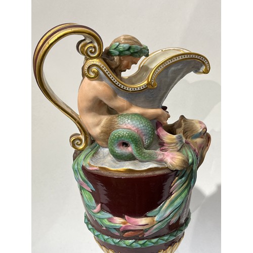 6052 - A pair of late 19th/early 20th Century Naples jugs with Merman and Pan to spout, 40cm tall, approx 2... 