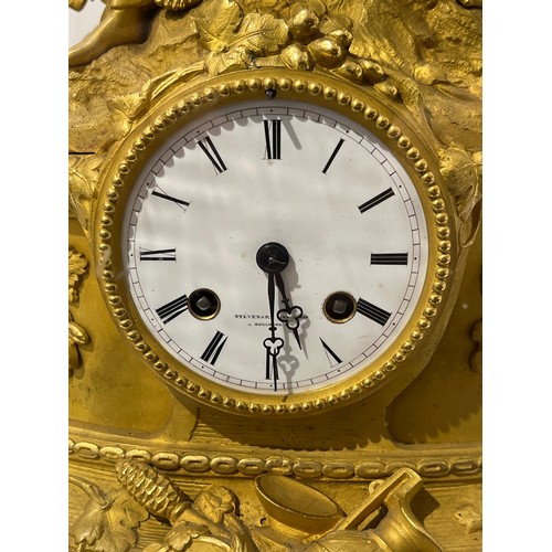 6055 - A 19th Century French Stevenard of Boulogne ormolu and gilt mantel clock, the case surmounted by a f... 