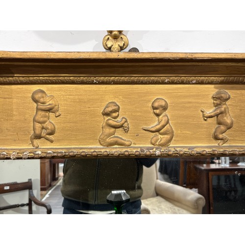 6063 - An early 19th Century ornate gilt gesso frame wall mirror with Corinthian reeded columns and child d... 