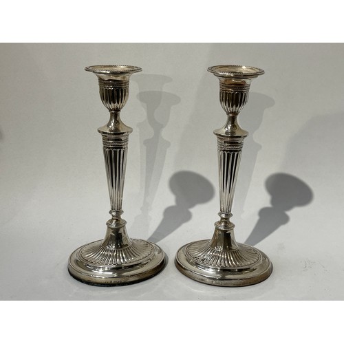 6064 - A pair of Fordham & Faulkner silver Adam style candlesticks with weighted bases, Sheffield 1912, 29.... 