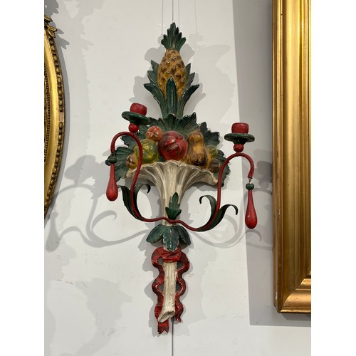 6067 - A pair of painted wool and metal wall hanging candle sconces of pineapple and fruit design, 71.5cm t... 