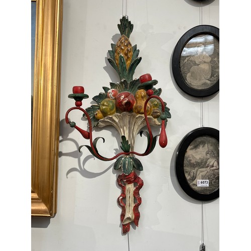 6067 - A pair of painted wool and metal wall hanging candle sconces of pineapple and fruit design, 71.5cm t... 