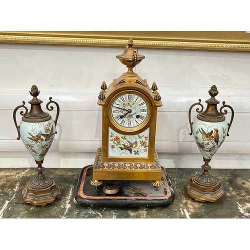 6076 - A Waterhouse & Co brass and enamel French clock garniture with bird detail, back open, 37cm x 18cm