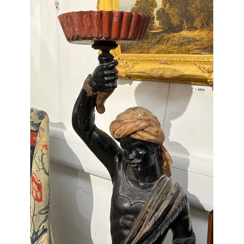 6095 - A 19th Century carved wood blackamoor figure holding aloft & fluted tray cracks and repair to arm pr... 