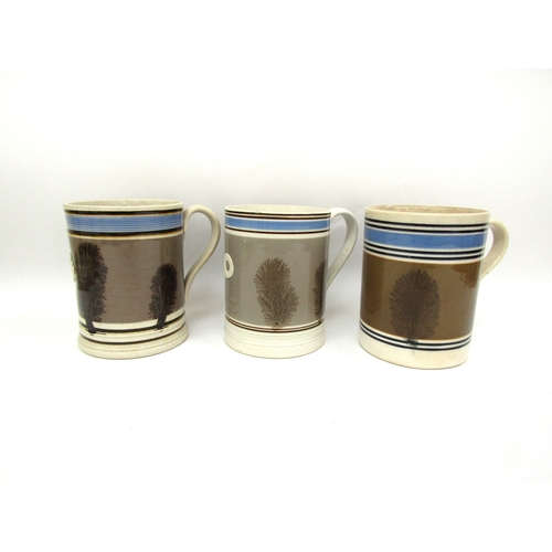 6058 - Three Quart Mocha ware tankards all in pale brown, 15cm tall