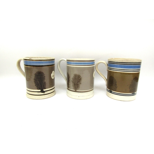 6058 - Three Quart Mocha ware tankards all in pale brown, 15cm tall