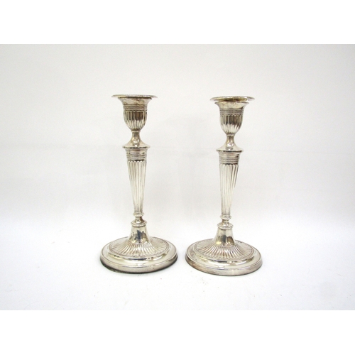 6064 - A pair of Fordham & Faulkner silver Adam style candlesticks with weighted bases, Sheffield 1912, 29.... 