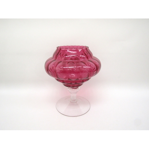 6119 - A cranberry glass lidded jar on pedestal base, one piece of prunt work damaged, 33cm tall